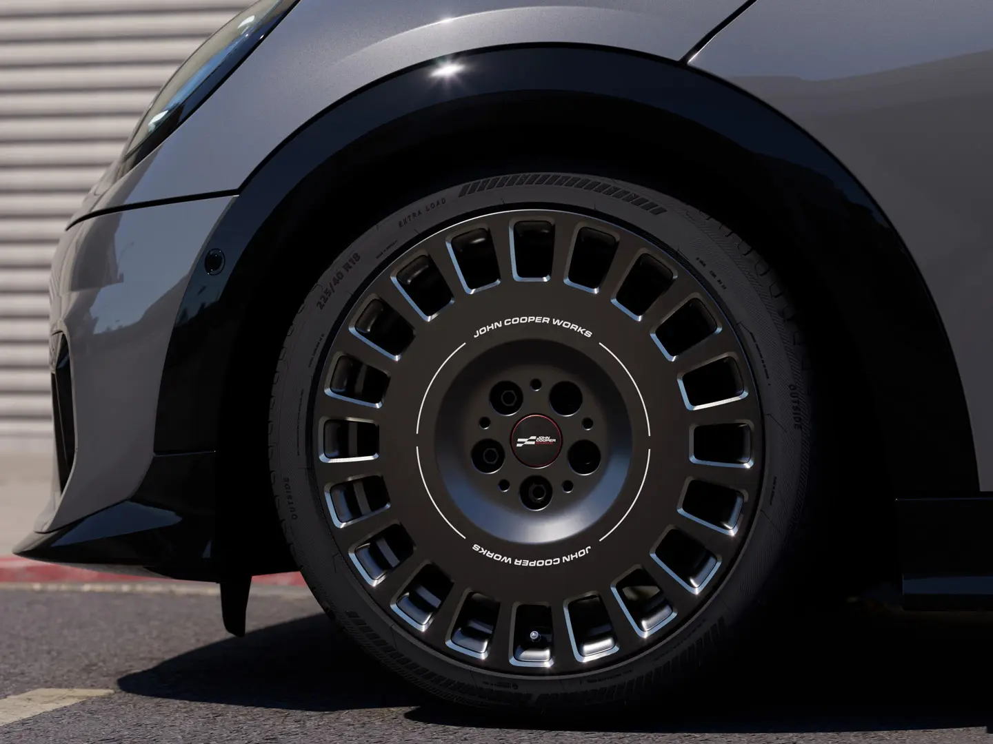 Close-up view of the diamond-milled detail on the Frozen Midnight Grey MINI JCW 18" Rallye Spoke 964 wheel. 