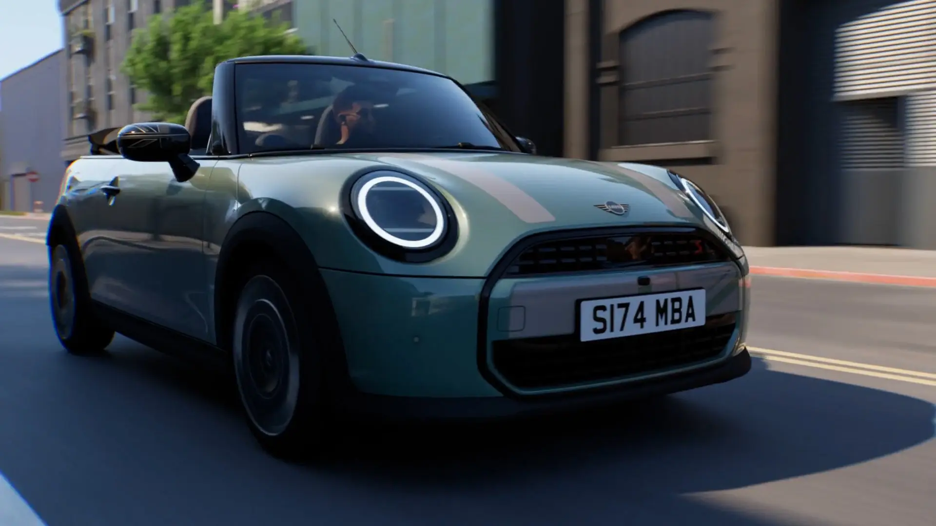MINI Convertible in Ocean Wave Green with MINI Heritage white decals and Union Jack mirror caps driving in the city.