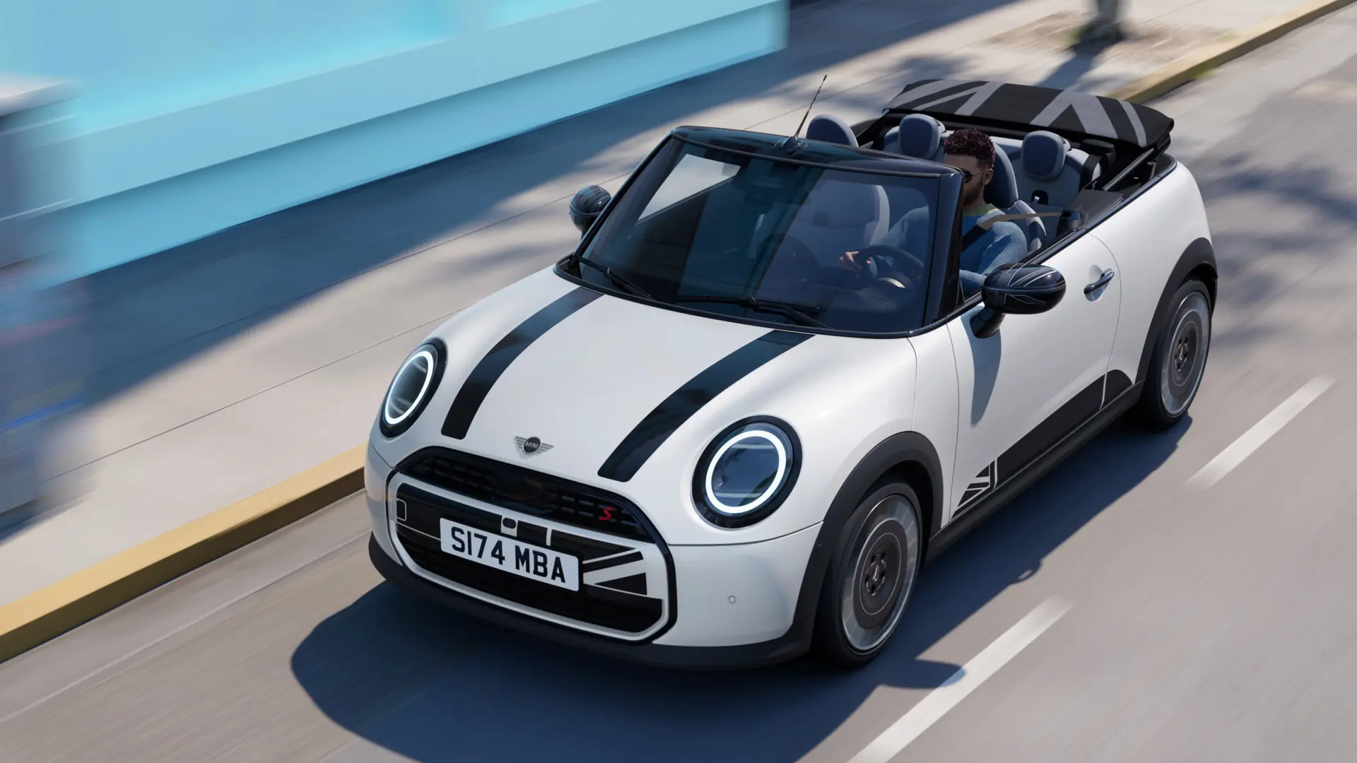 Overhead shot of MINI Convertible in Nanuq White with MINI Heritage bonnet decals in black. 