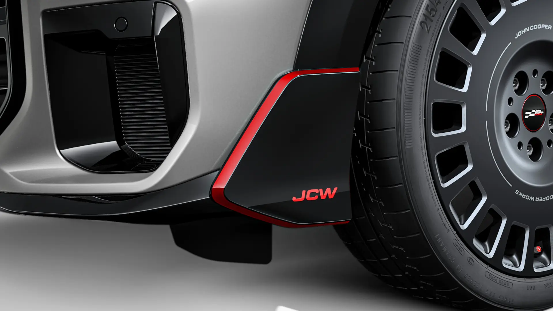 MINI John Cooper Works 전면 윙렛은 빨간색 JCW 레터링과 액센트 스트라이프가 있는 블랙 하이 글로시 재질입니다.