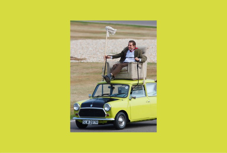 Rowan Atkinson as Mr.Bean on the Mini 1000 ''Mr. Bean'' at Goodwood Circuit in 2009.