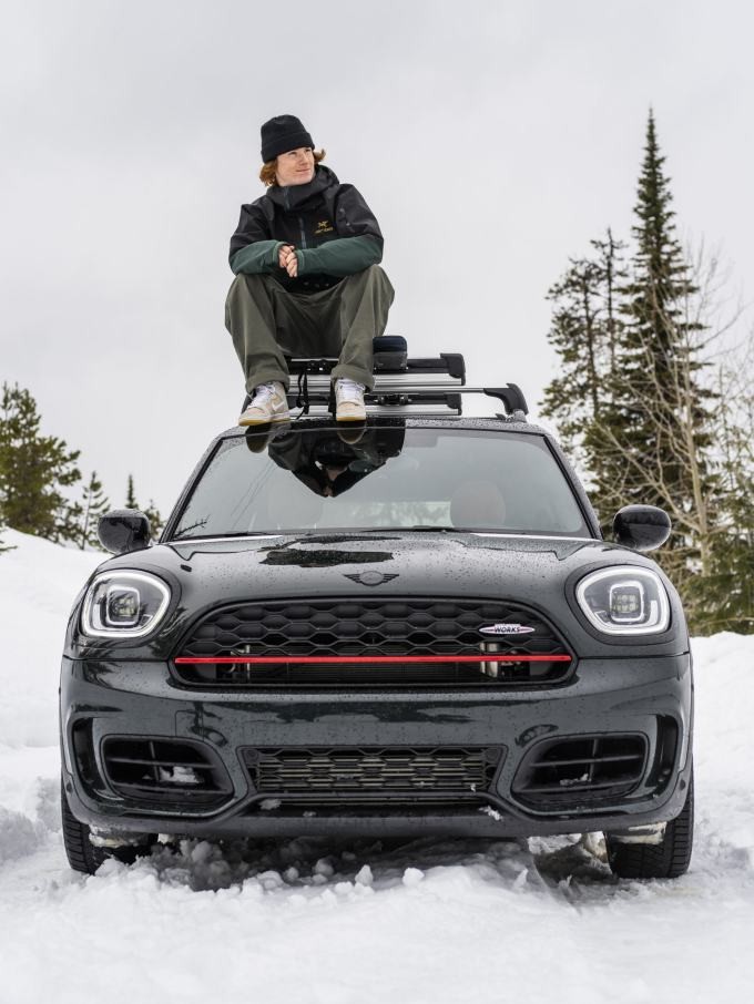 Professional Big Mountain skier Cole Richardson sitting on top of a MINI John Cooper Works Countryman ALL4.