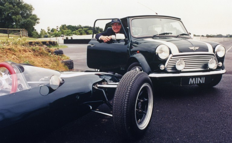 The legendary John Cooper sitting in the Mini John Cooper LE, sold in 1999, commemorated Mini’s 40th anniversary and Cooper's first F1 World Championship win.